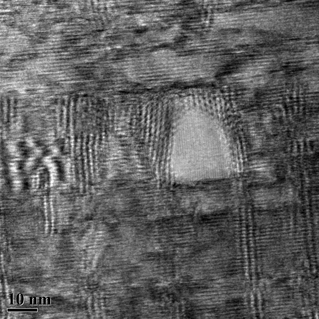 Fig. 1b. cross sectional TEM image showing complex defect microstructure in YBCO film with Ta and Nb-based double perovskite pinning additions. These unique pinning centres enable high field properties to be achieved. TEM image is courtesy of Wang TEM gro